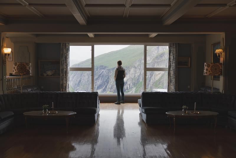 Silhouette of a woman enjoying the view towards the waterfall from one of the lounges.