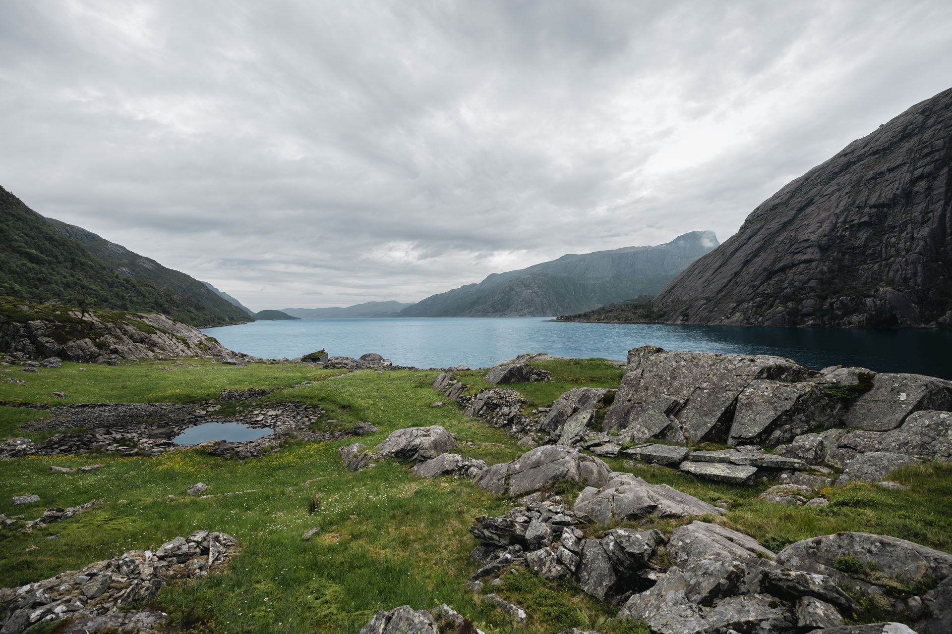The Vingen rock art landscape, with ancient carvings set among rocks overlooking the fjord.