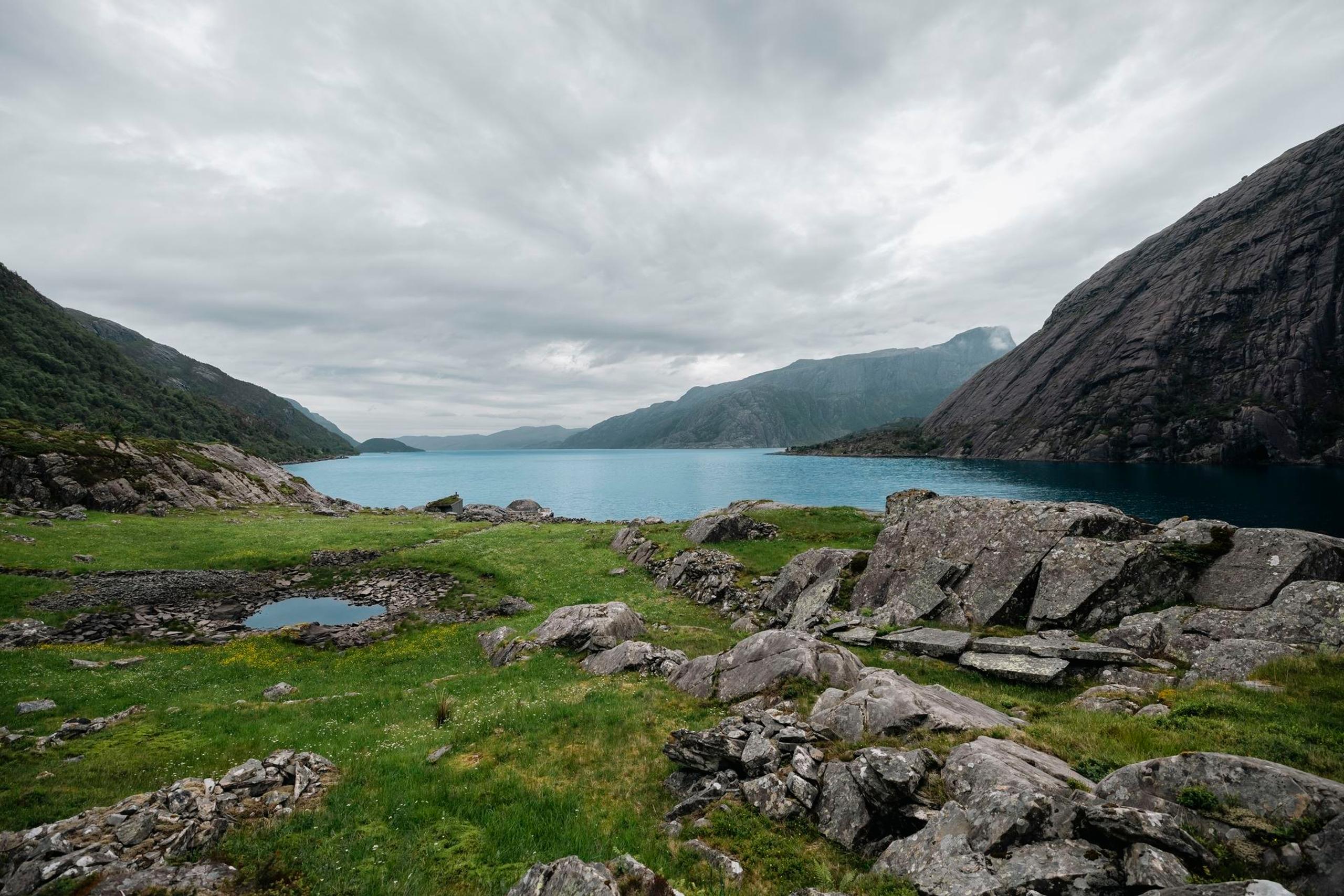 The Vingen rock art landscape, with ancient carvings set among rocks overlooking the fjord.