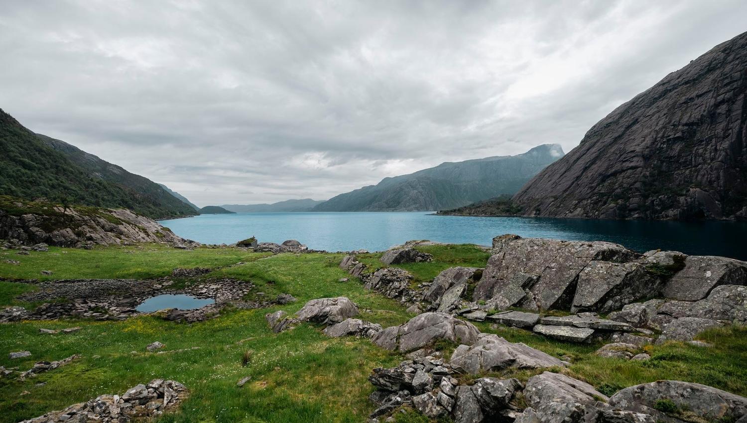 The Vingen rock art landscape, with ancient carvings set among rocks overlooking the fjord.