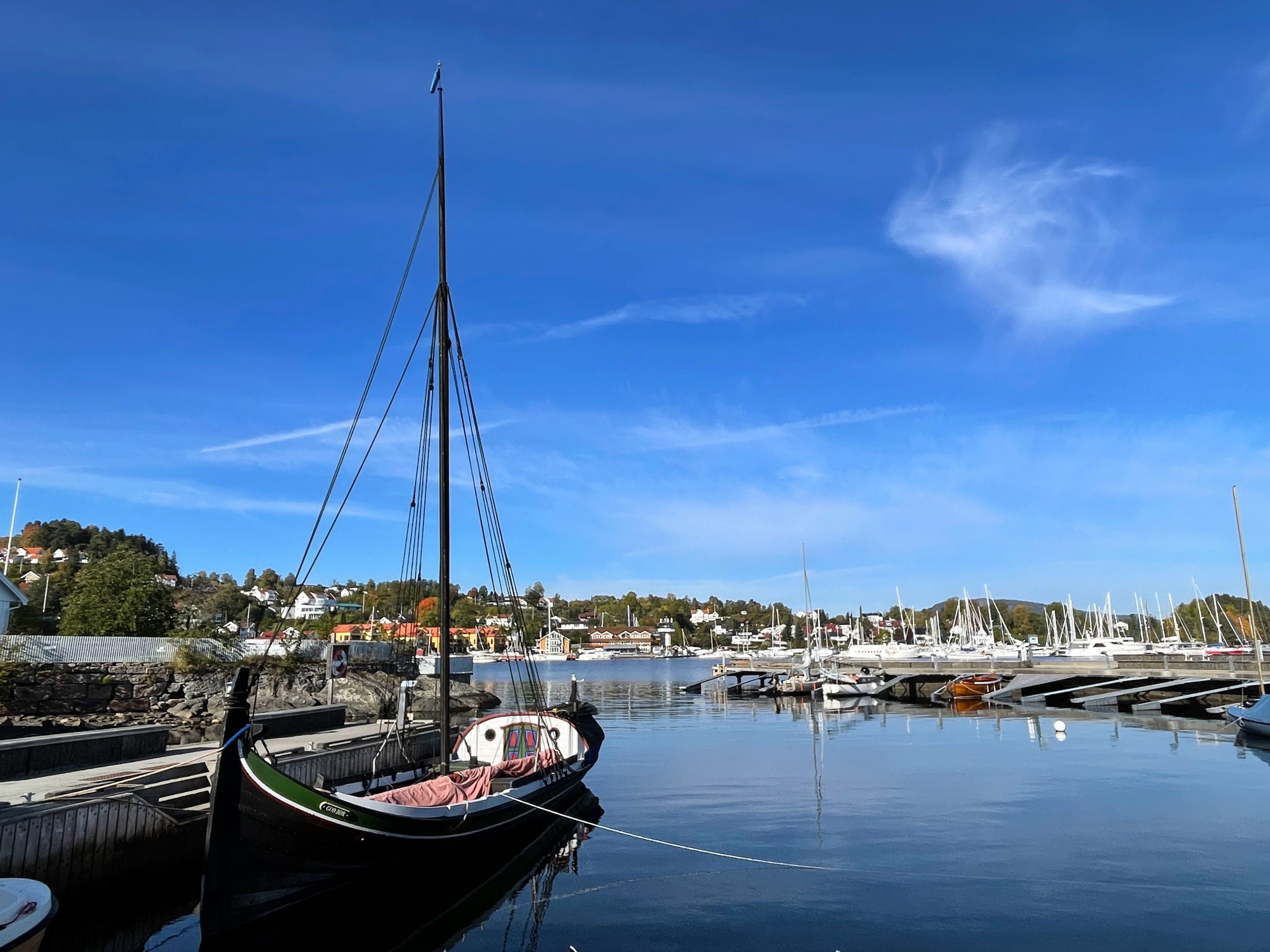 Boat in the harbour, blue sea and sky