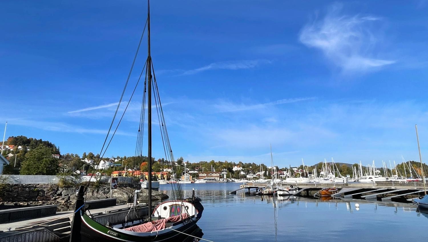Boat in the harbour, blue sea and sky