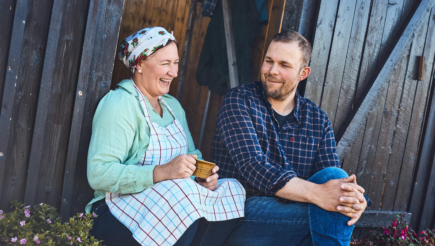 Two people enjoying coffee on the steps