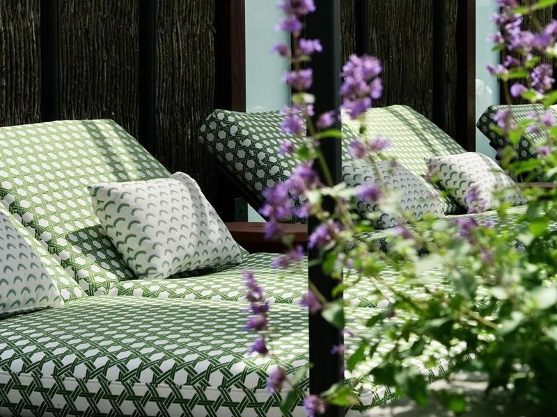 CabanasThe Well - outdoor lounge with green dotted covers