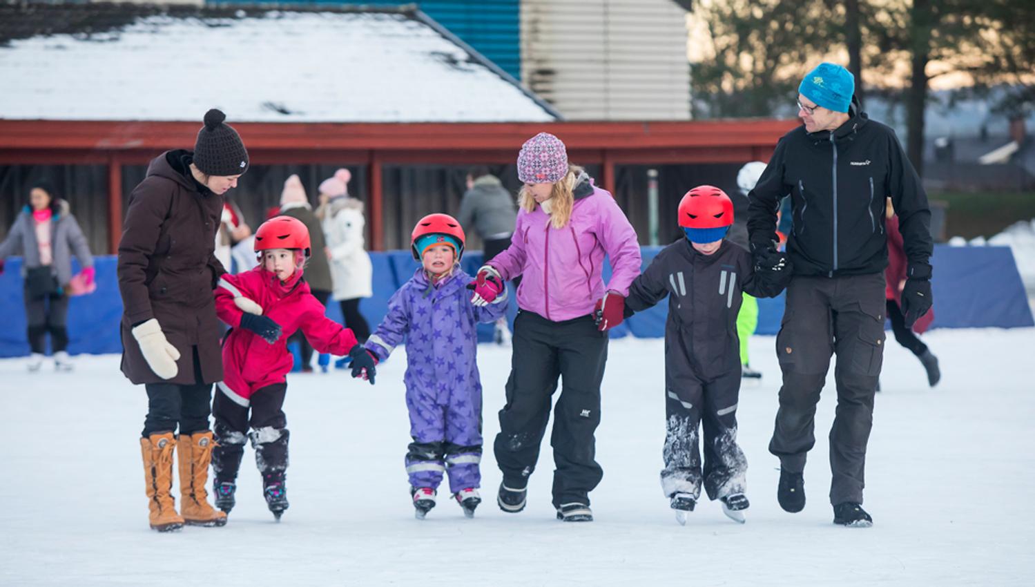 family on the skating rink in Skien leisure park