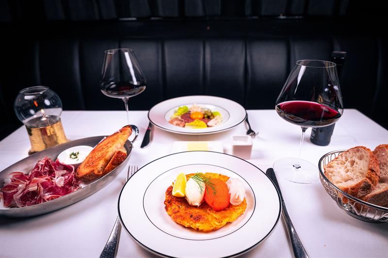 Table set with different dishes and wine 