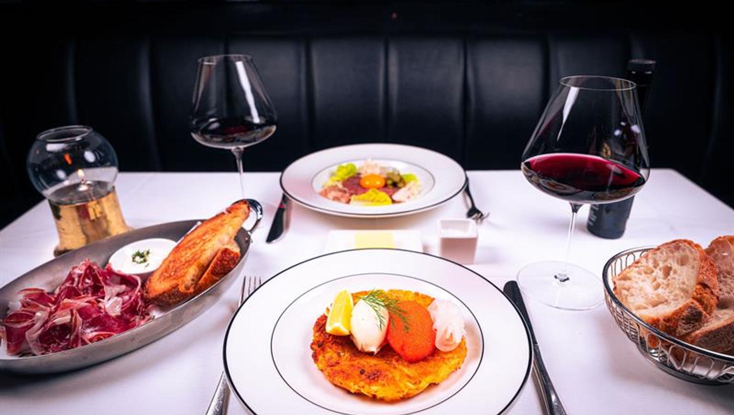Table set with different dishes and wine