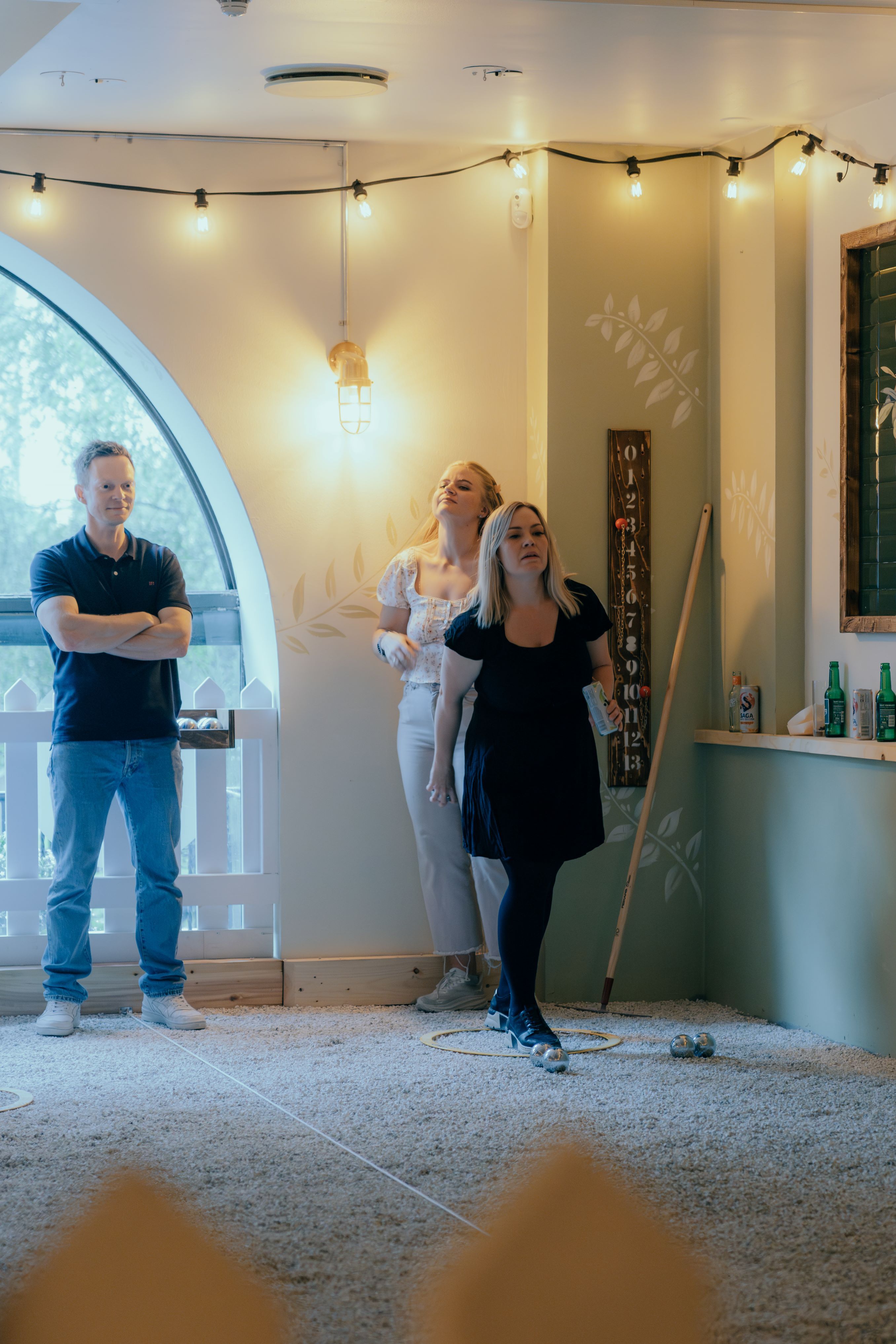 Three people playing boule
