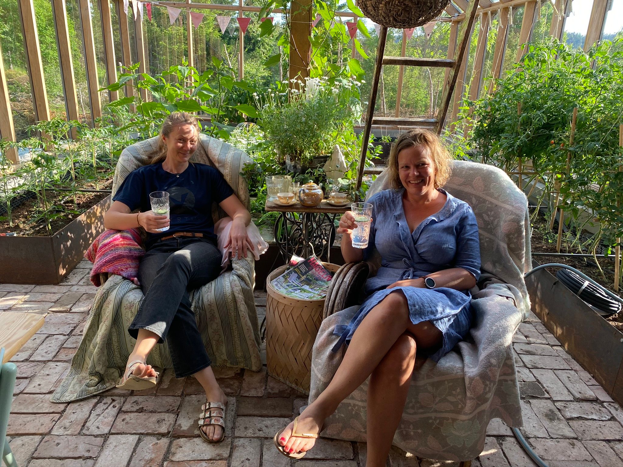 to women sitting together in a garden