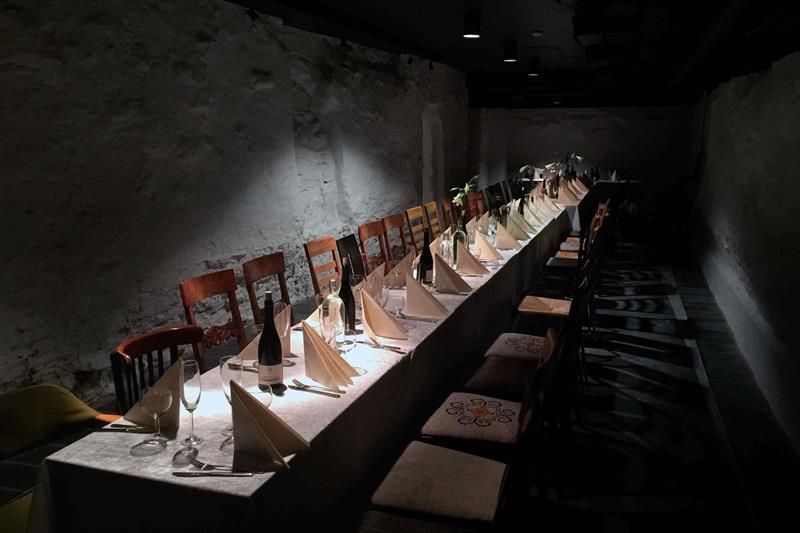 Long table set for dining and chairs.
