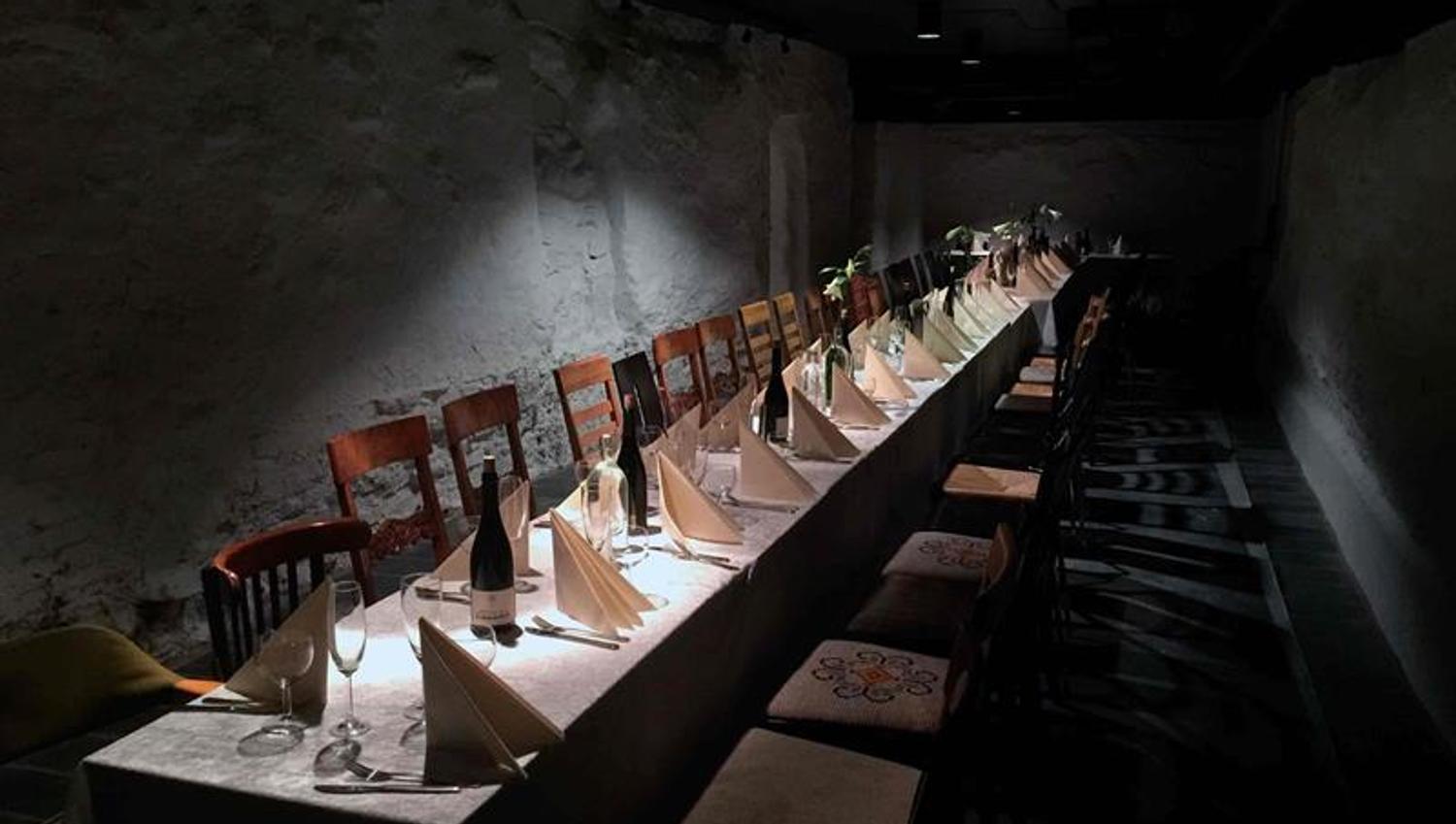 Long table set for dining and chairs.