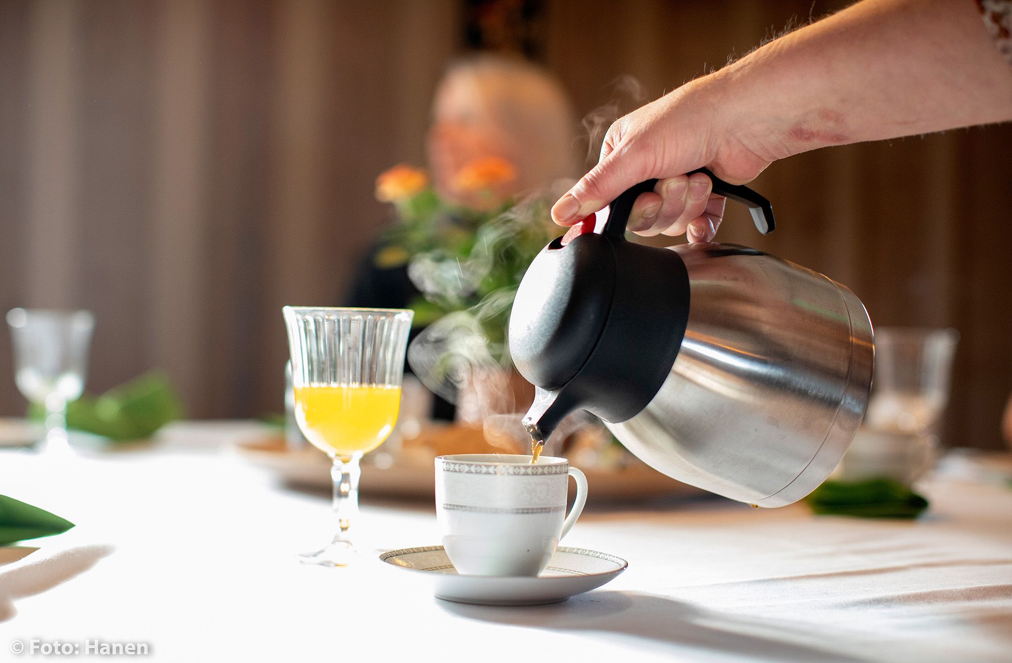 Coffee being poured into a coffee cup