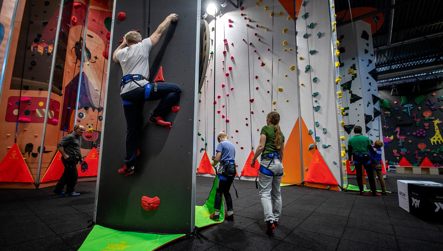 People climb the climbing wall