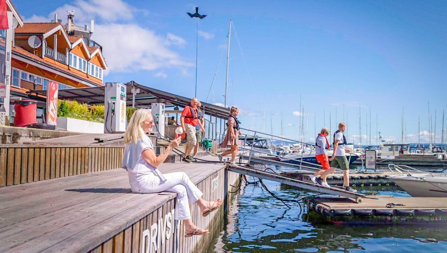 Lady eating icecream on the jetty