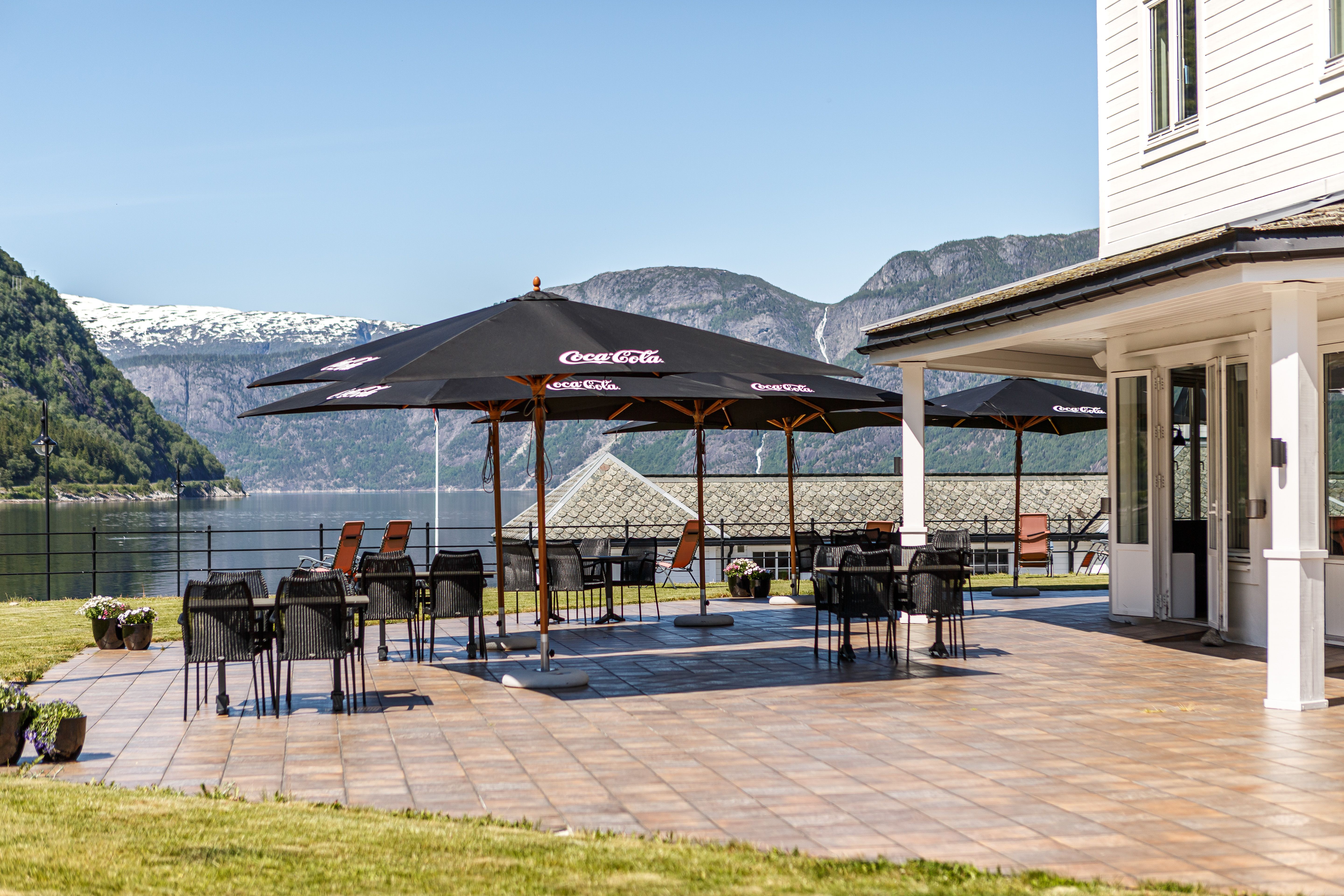 The outdoor patio with parasols, chairs and tables.