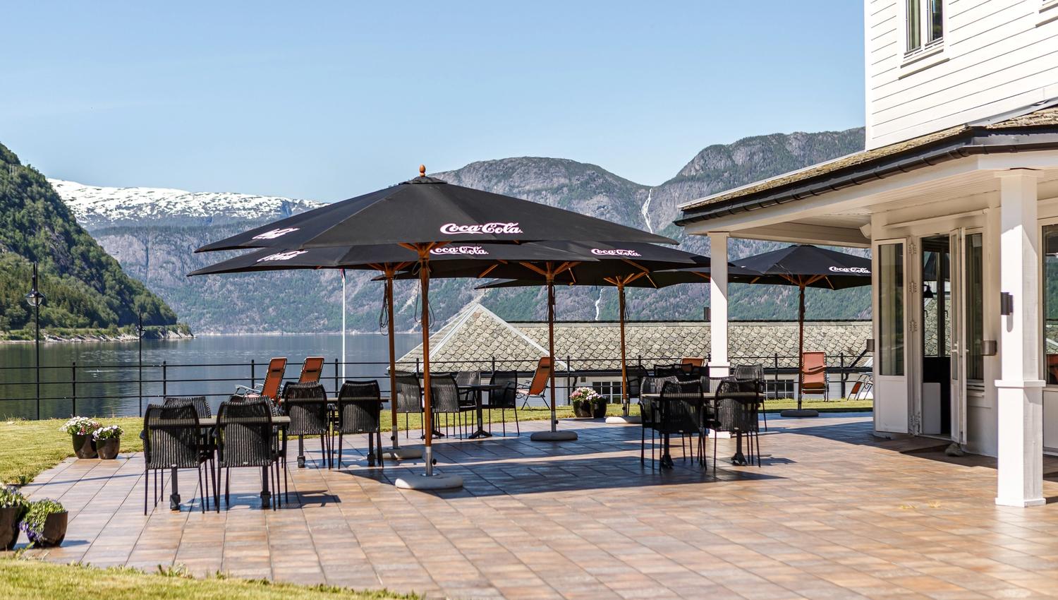 The outdoor patio with parasols, chairs and tables.