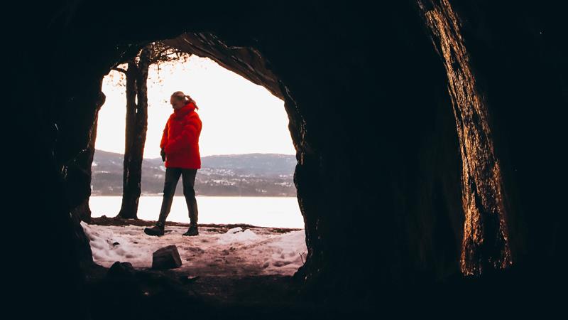 A person in view from the cave
