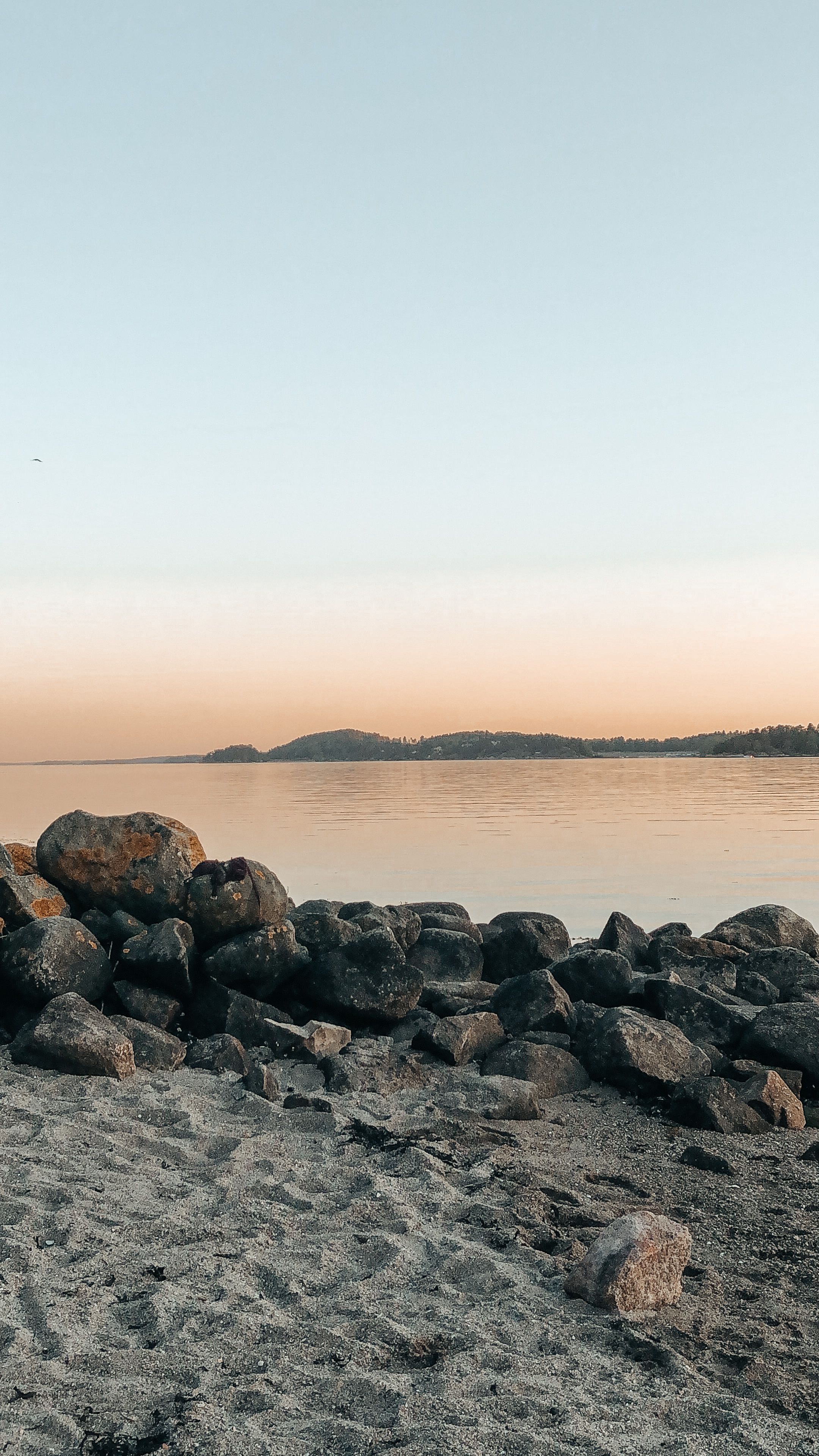 Solnedgang fra sandstranden på Høysand. Foto.