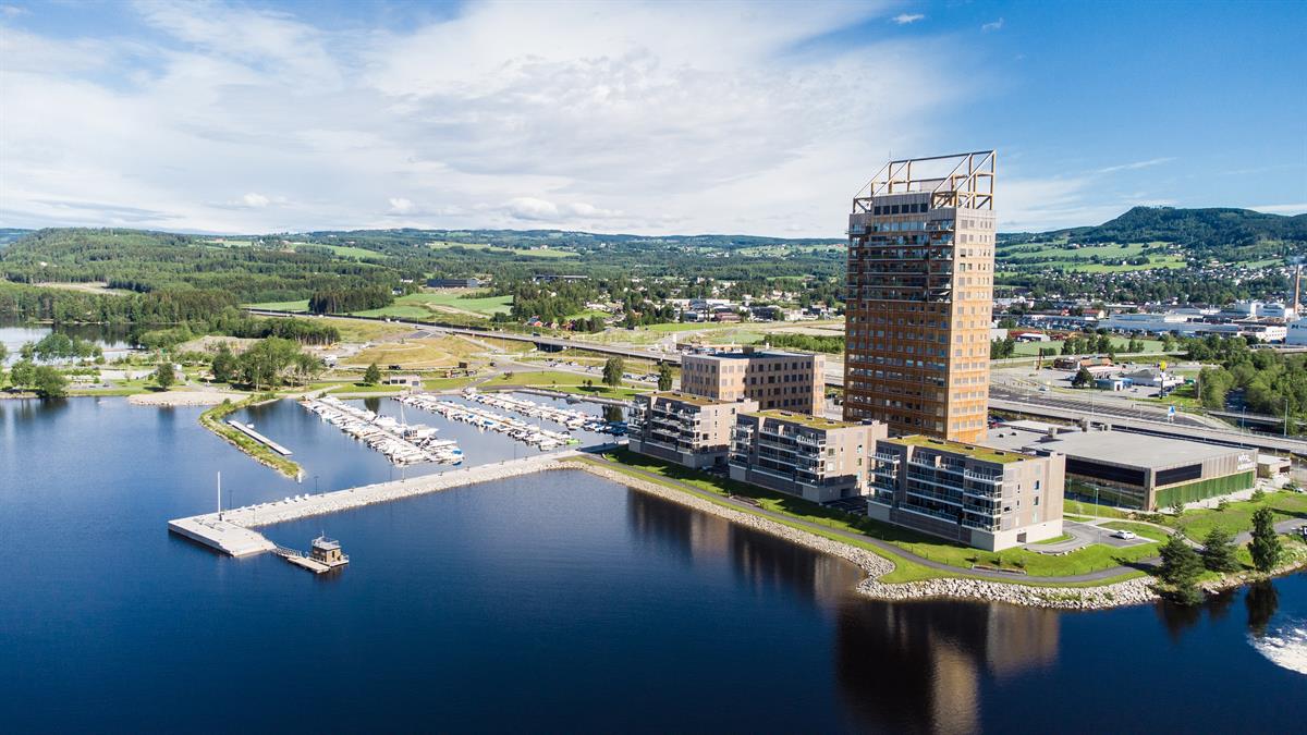 Drone image of Wood Hotel and Brumunddal in the background