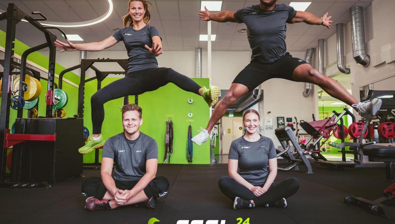 Gym – four happy people posing for the camera