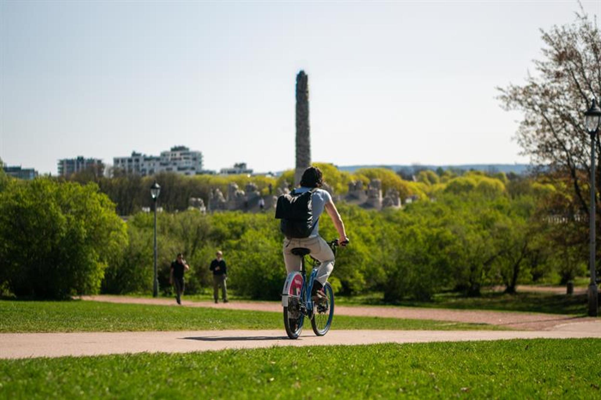 Man biking in the Vigeland Sculpture Park