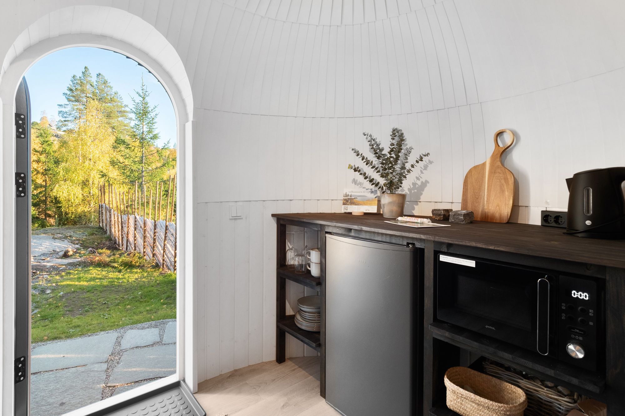 Small kitchen with an open door out