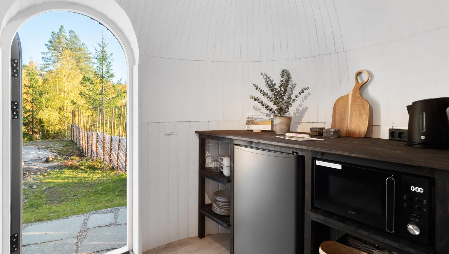 Small kitchen with an open door out
