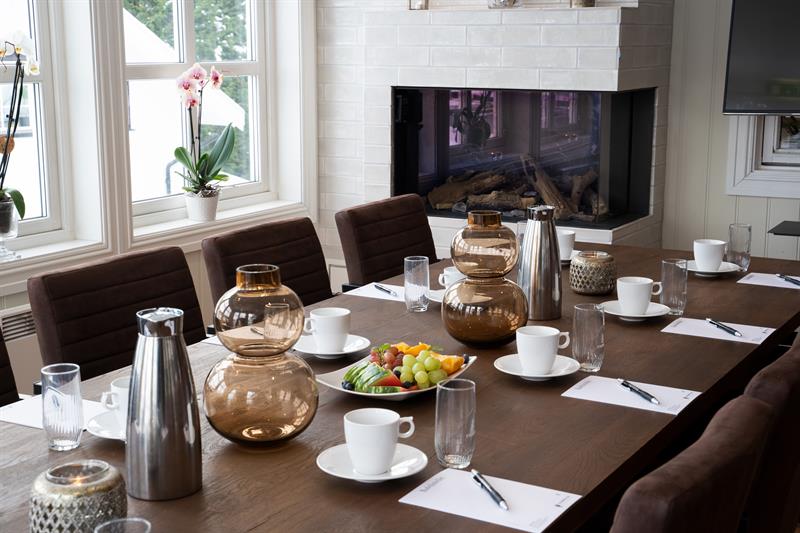 Set for meeting in front of the fireplace