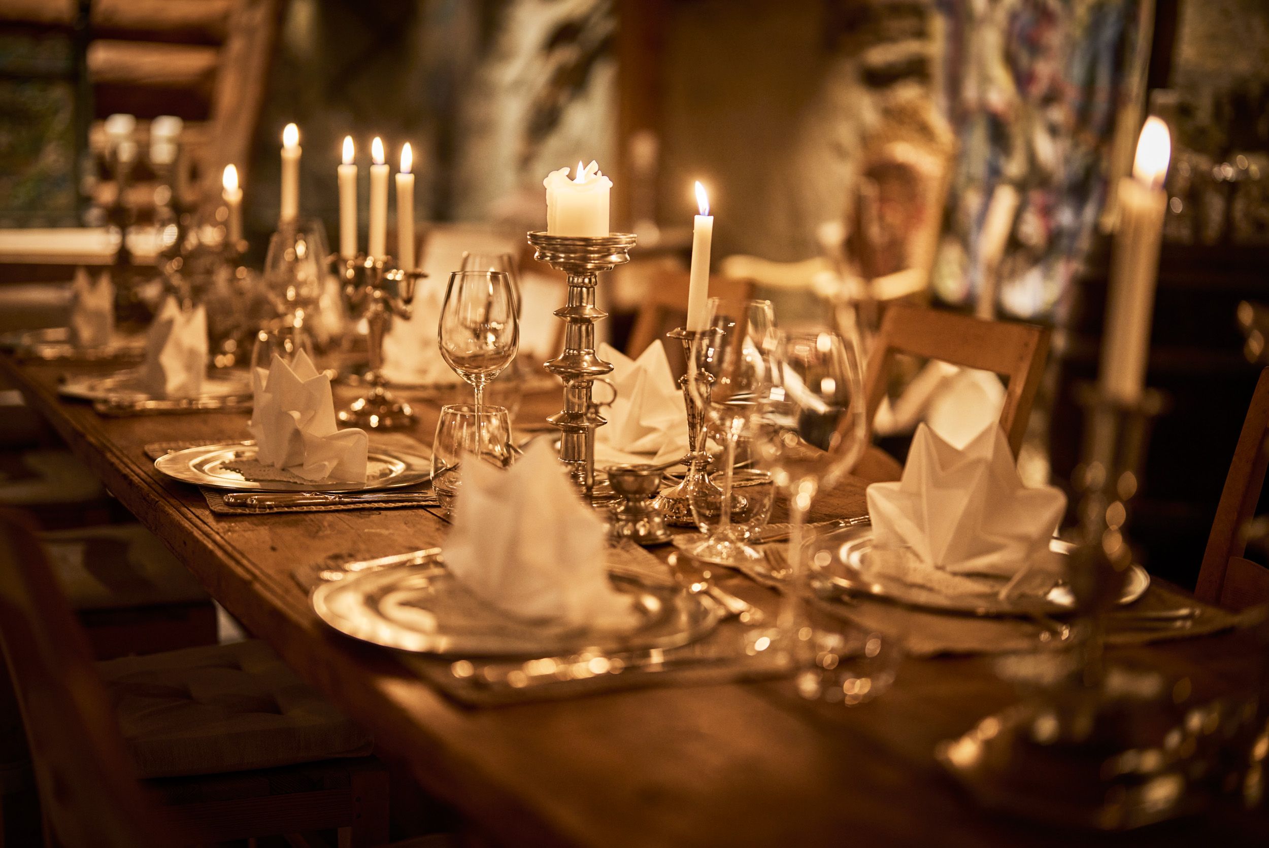 Candlelit table setting in the intimate wine cellar at Hotel Ullensvang.