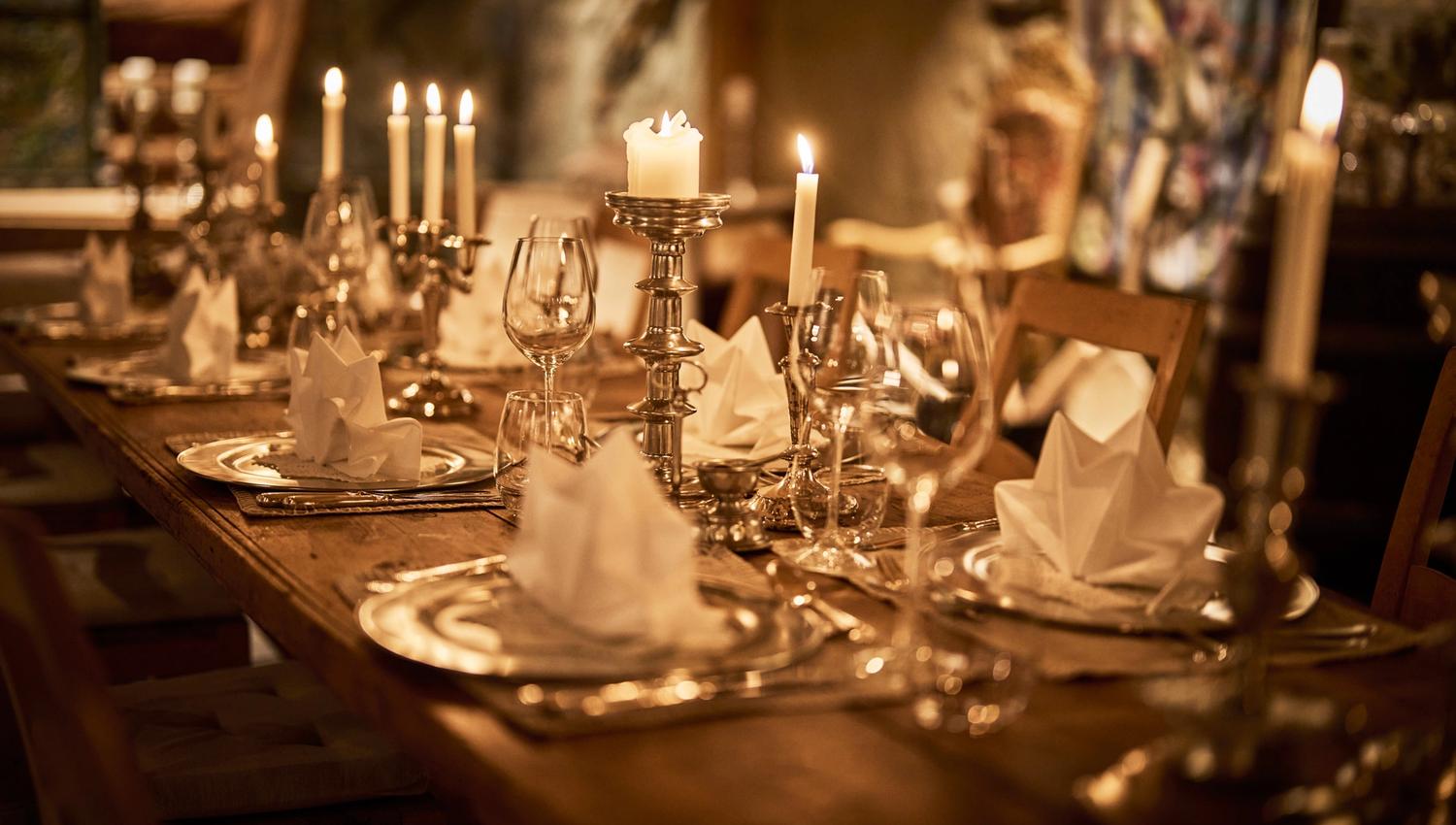Candlelit table setting in the intimate wine cellar at Hotel Ullensvang.