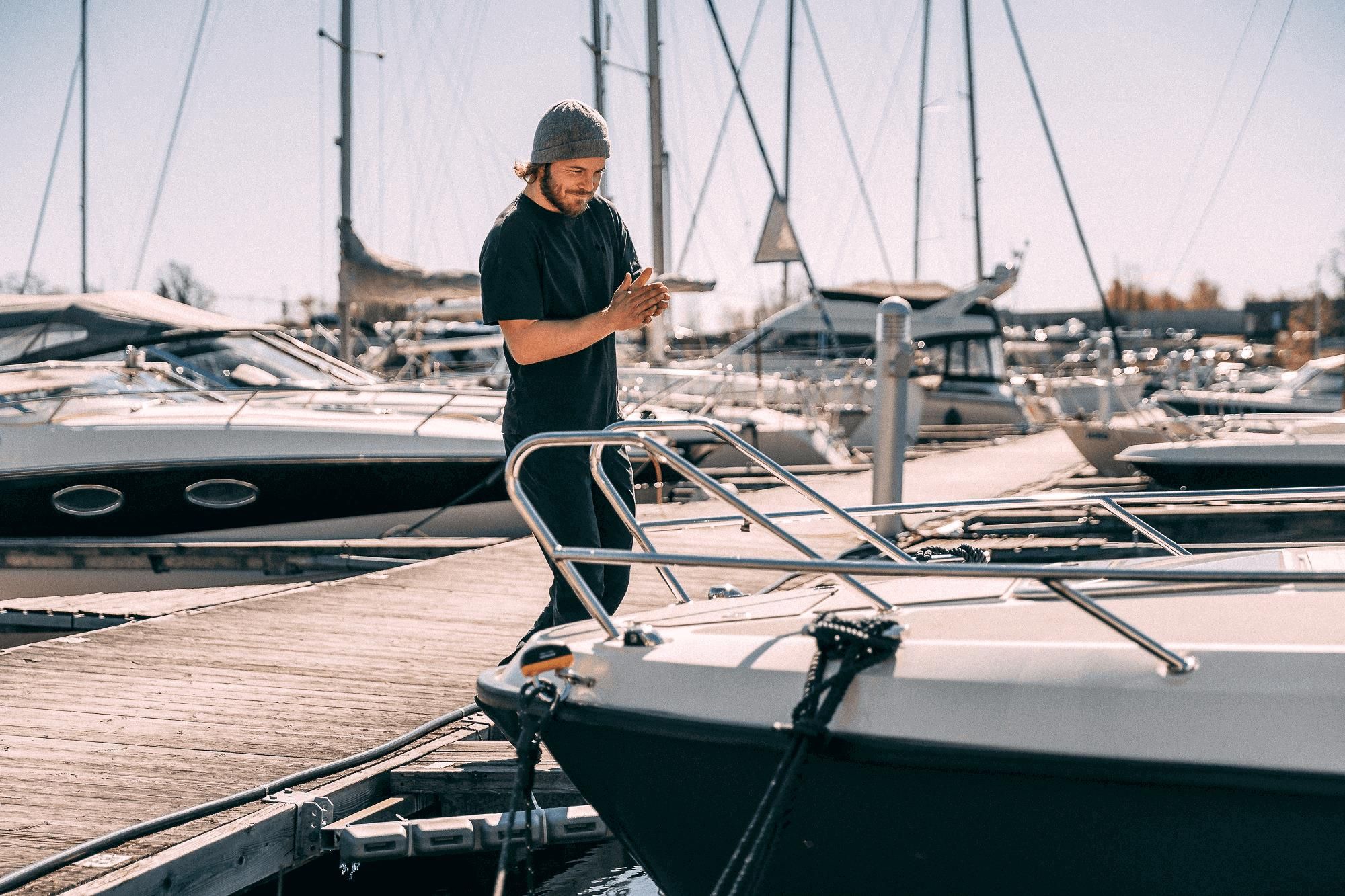 Man at the pier by a boat