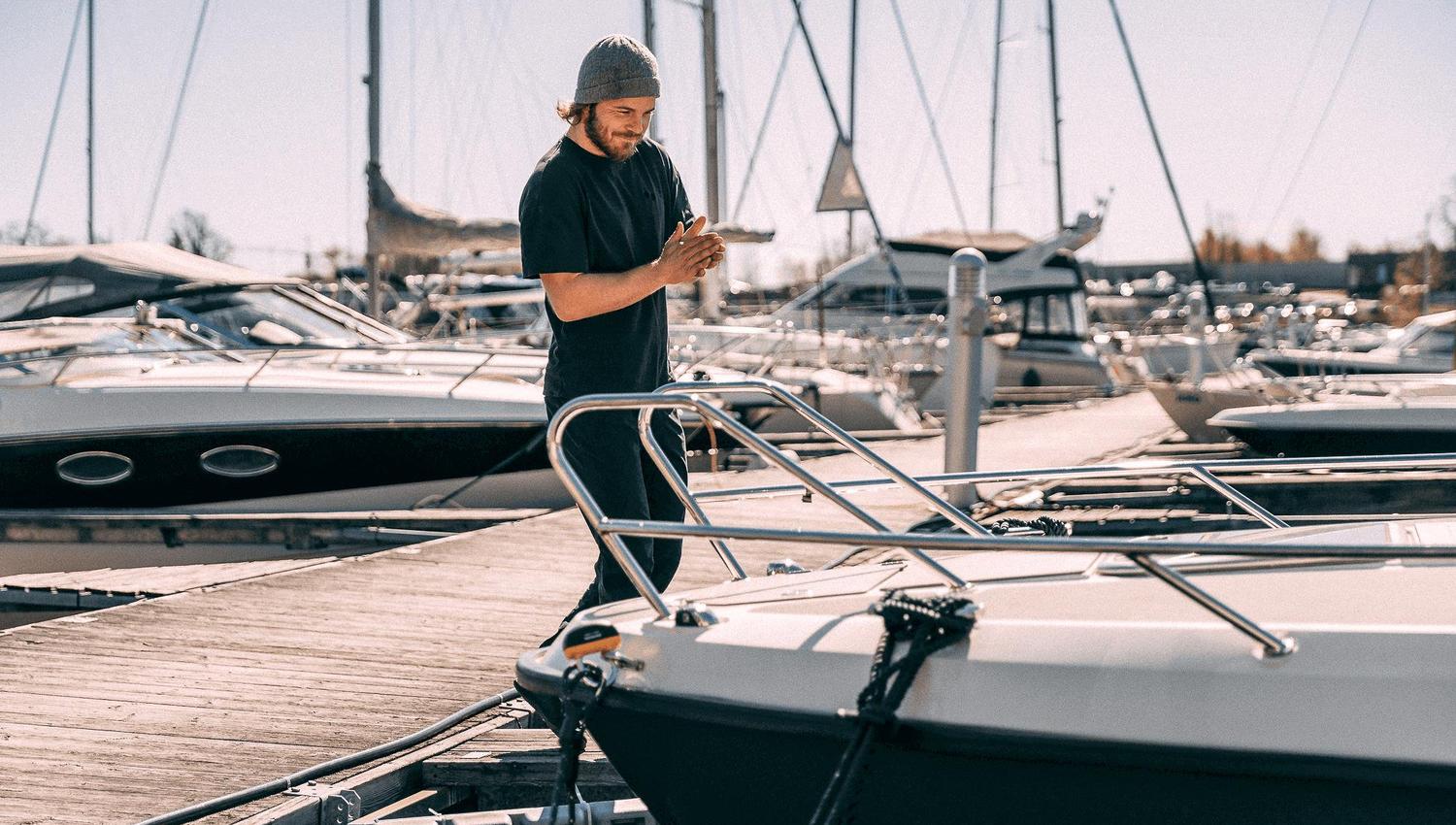 Man at the pier by a boat