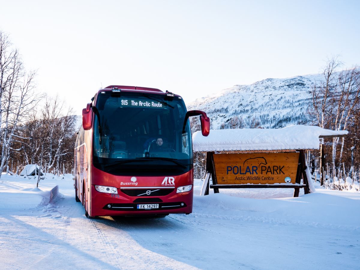 Arctic Route bus by the Polar Park sign