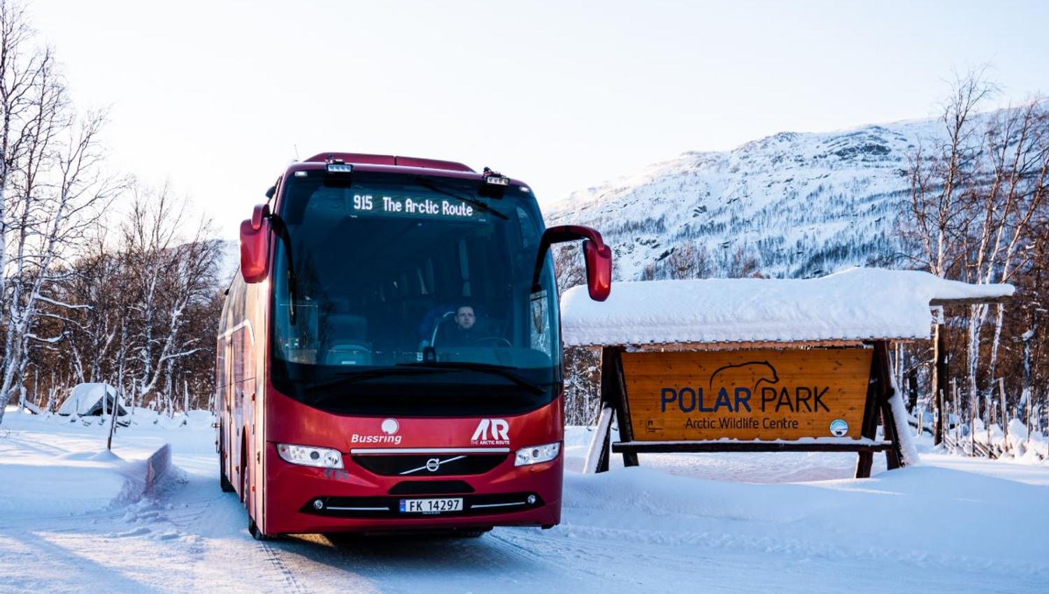 Arctic Route bus by the Polar Park sign