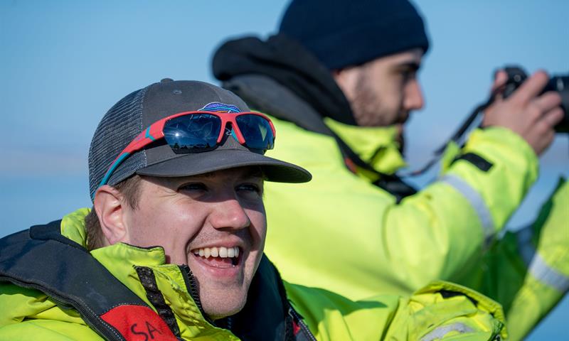 Two people smiling in the sun