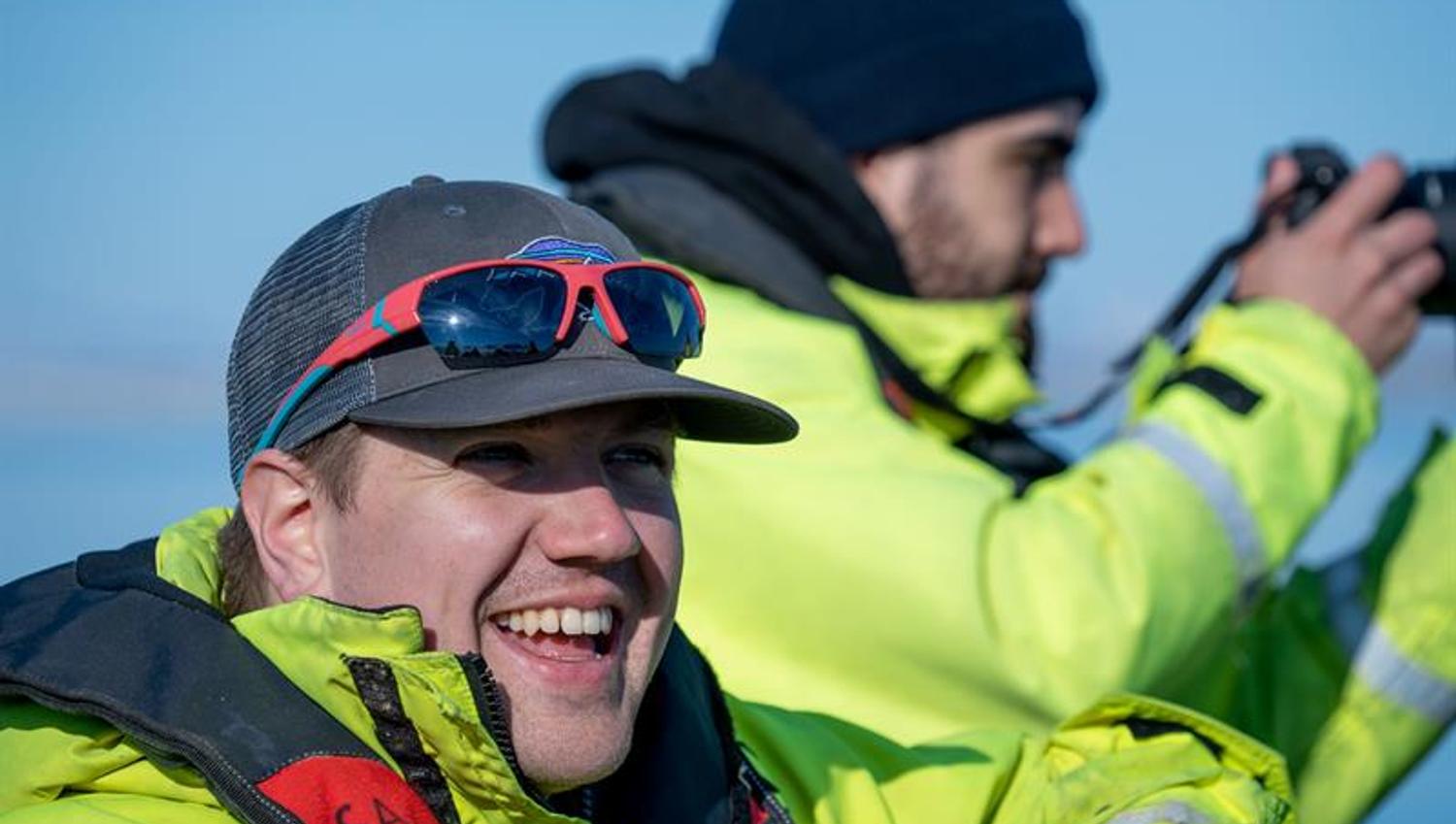 Two people smiling in the sun
