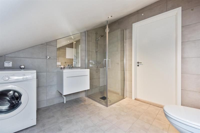 Modern bathroom with washing machine