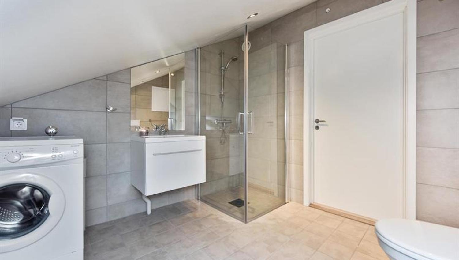 Modern bathroom with washing machine
