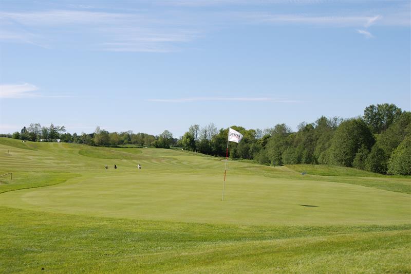 marked holes on the golf course