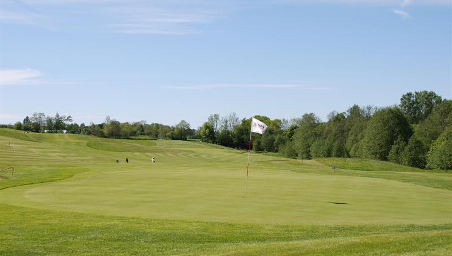 marked holes on the golf course