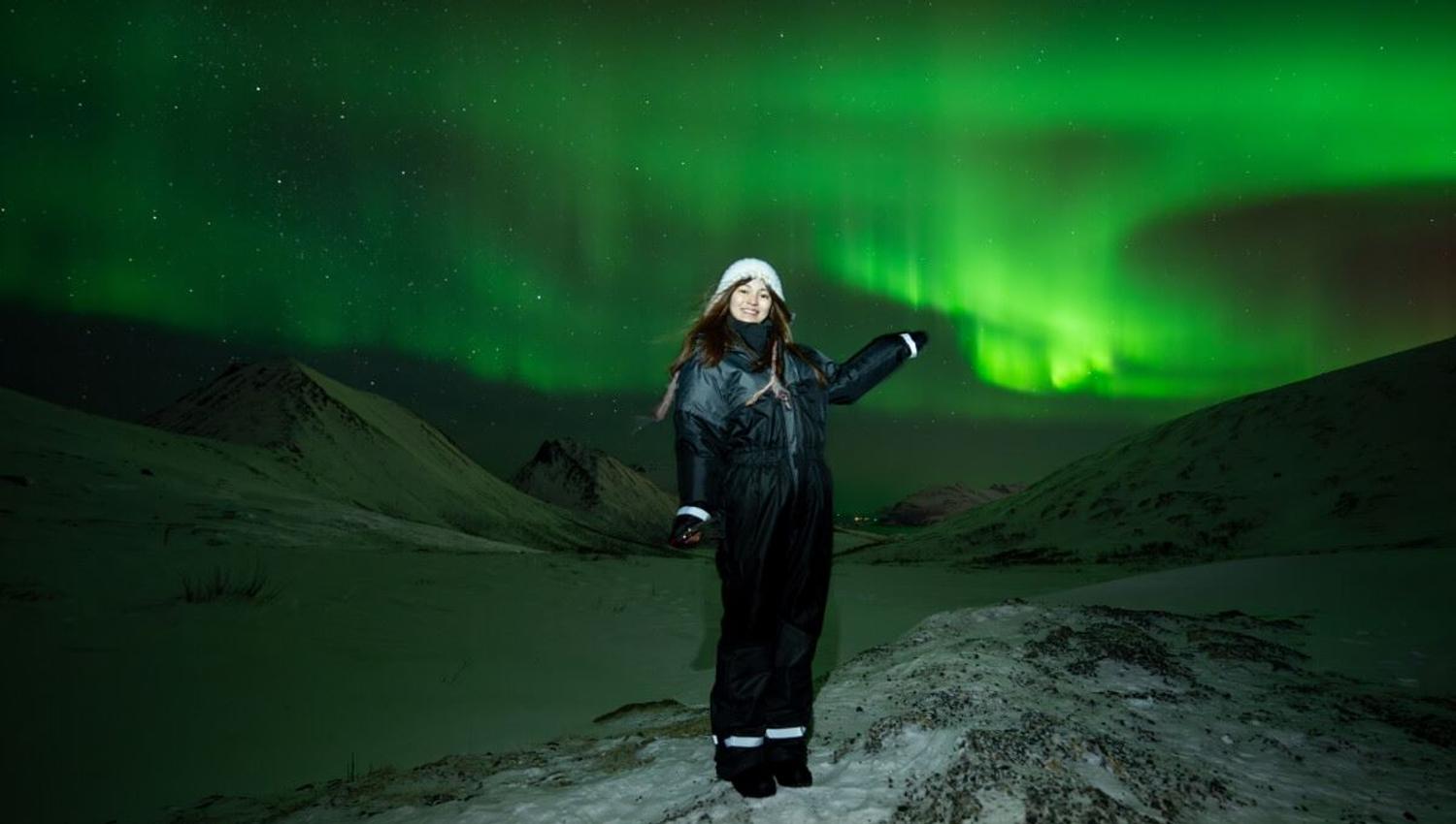 A guest points at the Northern Lights