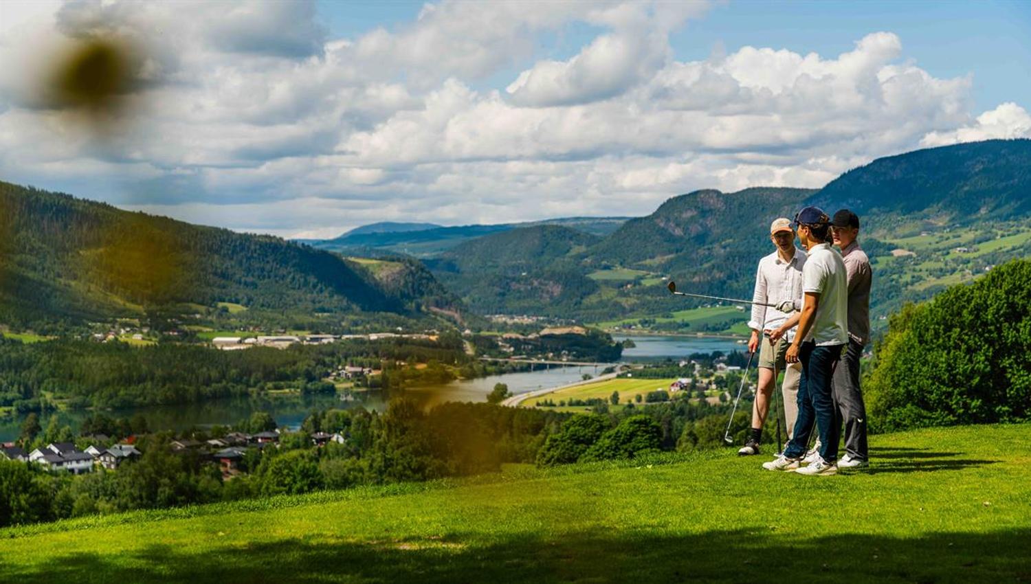 Golfers overlooking the landscape.