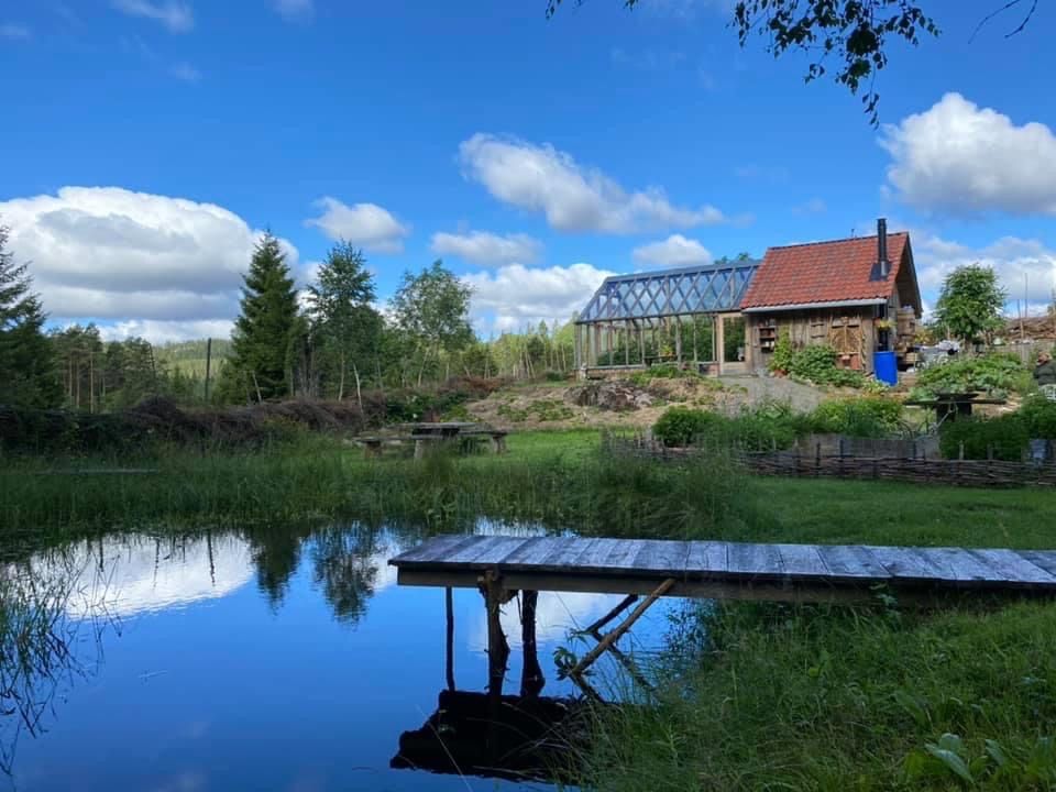 a small farmhouse by the water