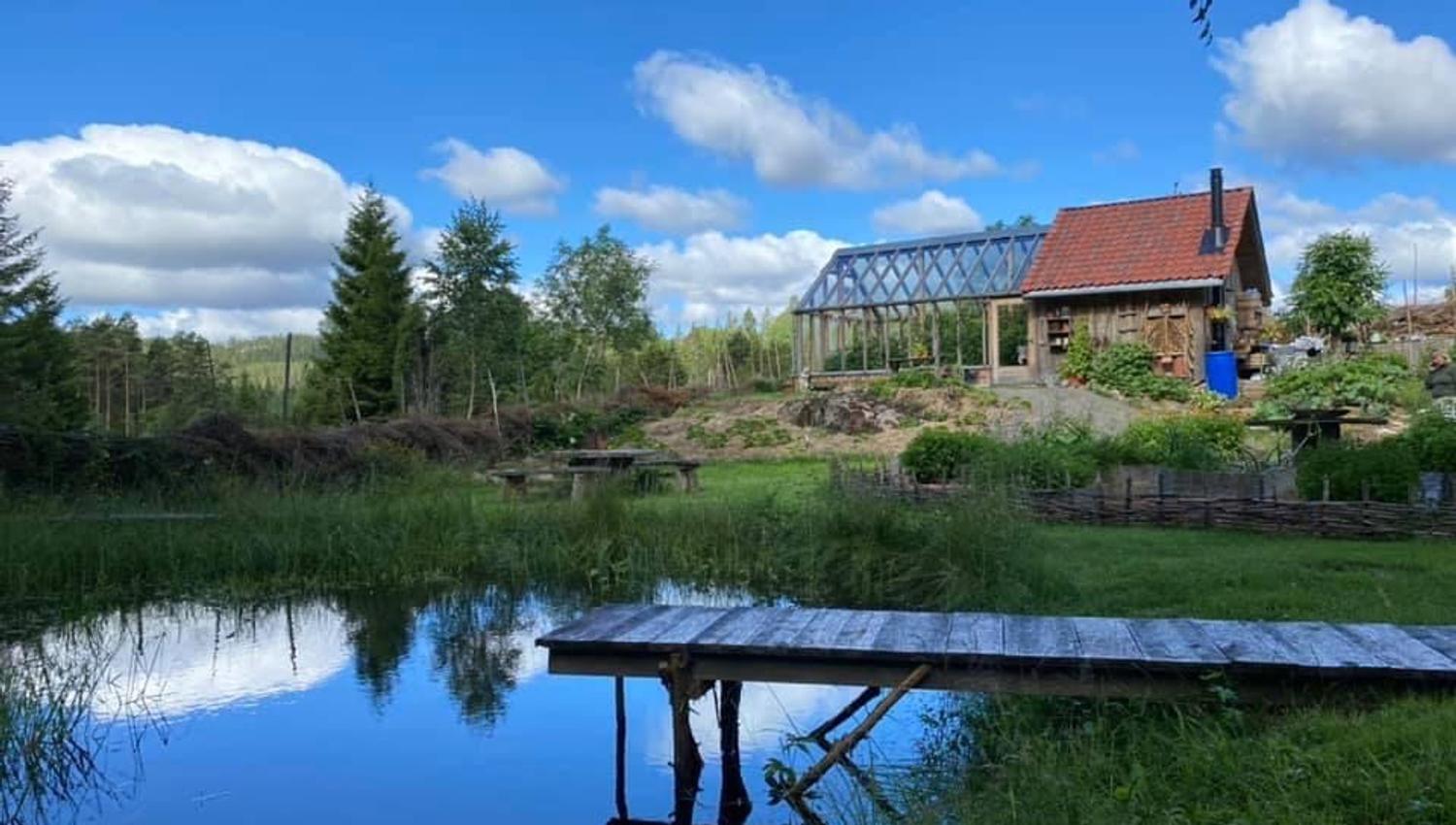 a small farmhouse by the water