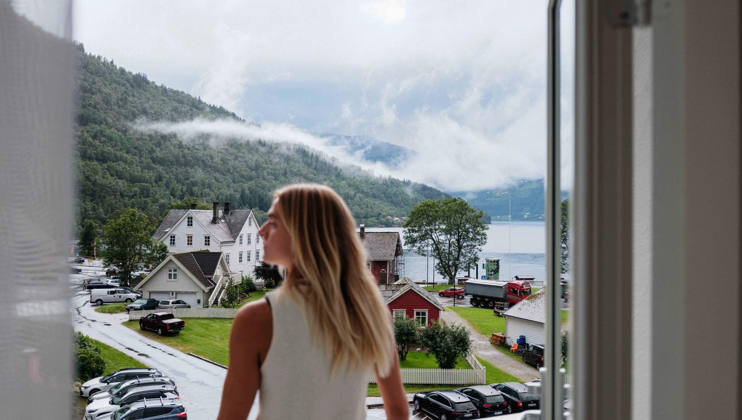 View from the balcony at Kinsarvik Fjordhotel overlooking the Hardangerfjord and Kinsarvik village.