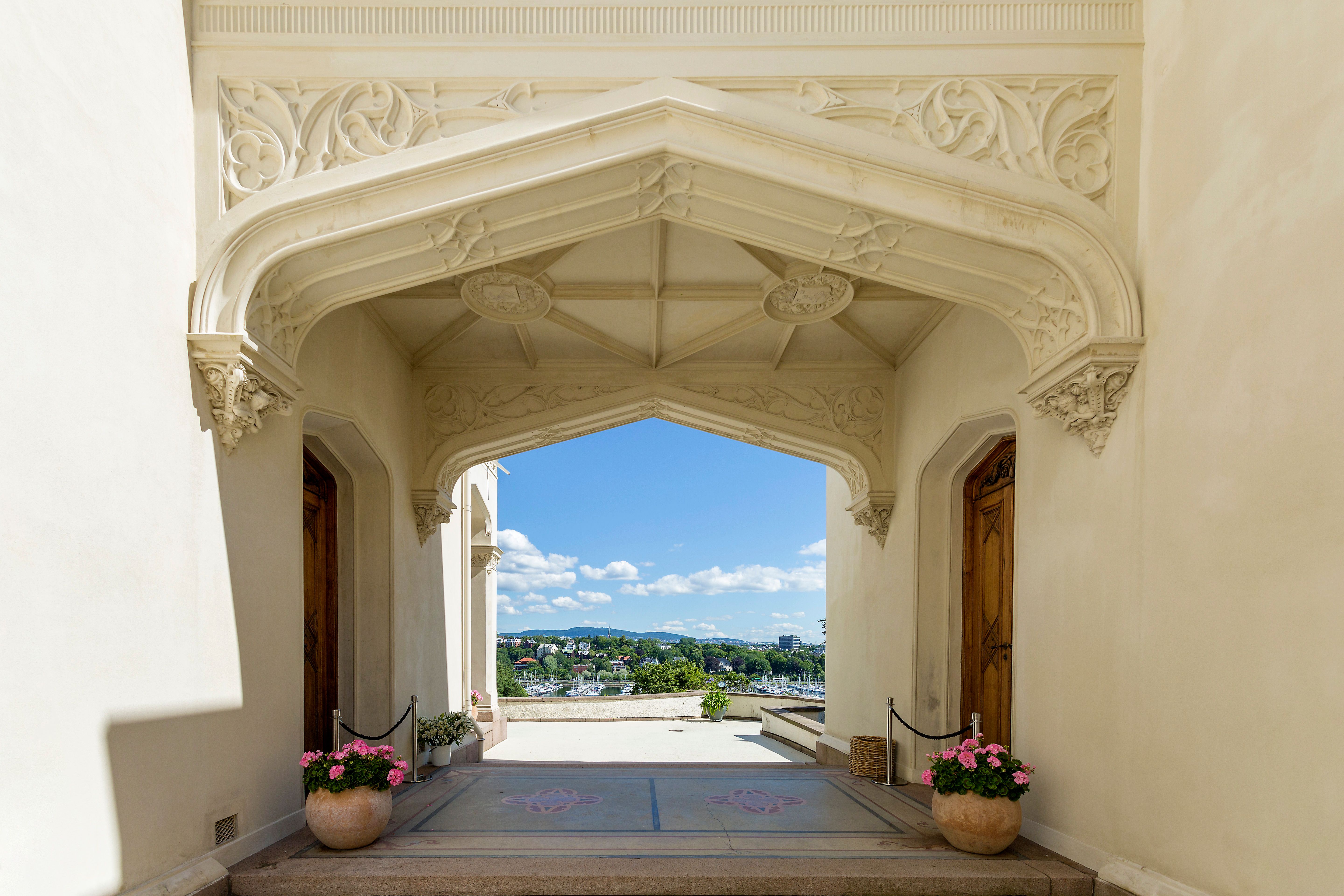 The entrance portal of Oscarshall with ornaments, flowers and views towards Oslo 