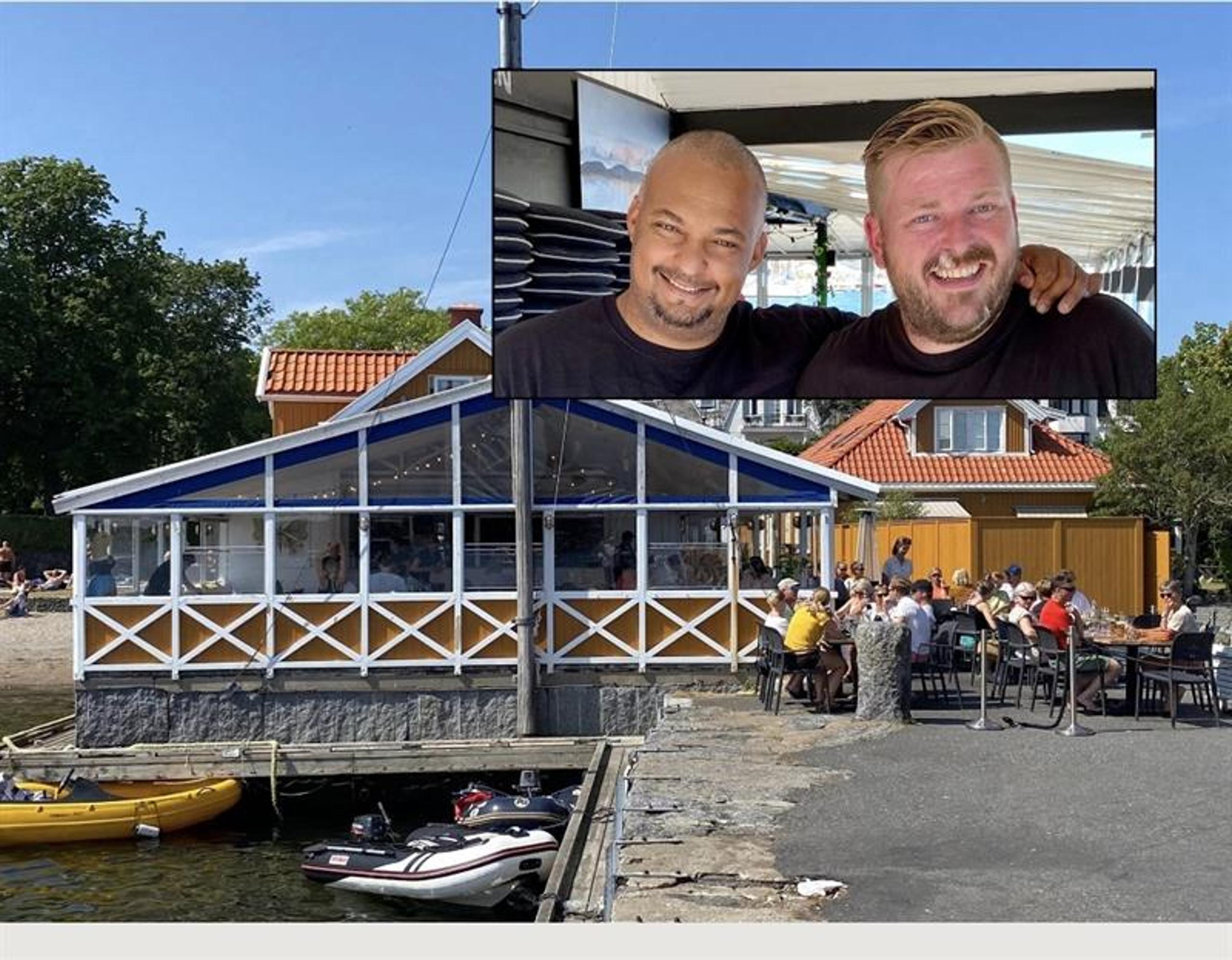 Uteserveringen ved Dampskipsbrygga Restaurant med gjester og sjøen like utenfor.