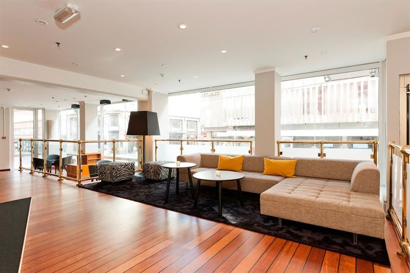 Lounge area with a big sofa and seats