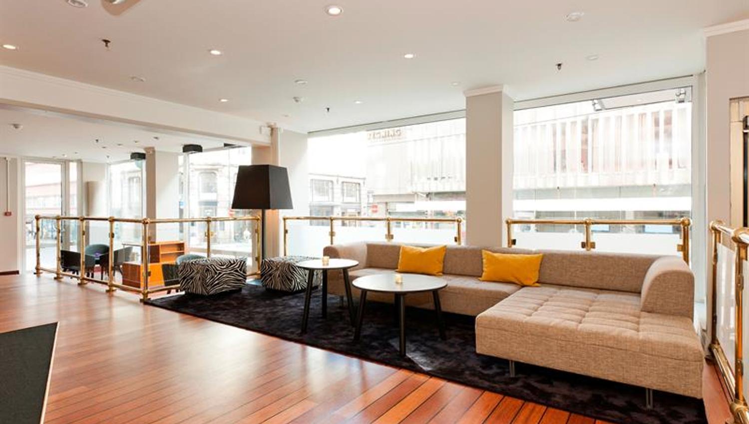 Lounge area with a big sofa and seats