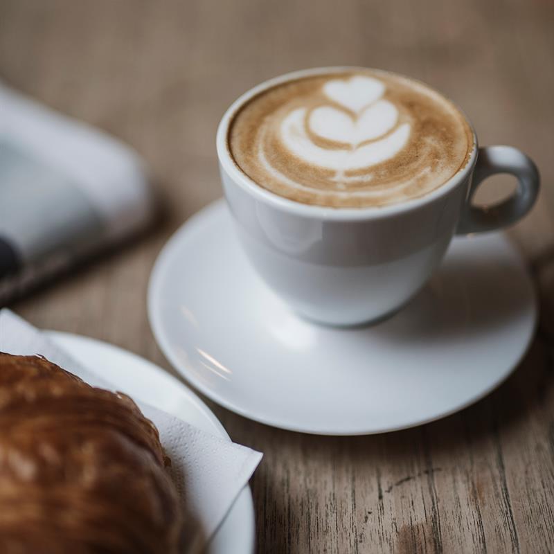 detail image: coffee cup and baked goods